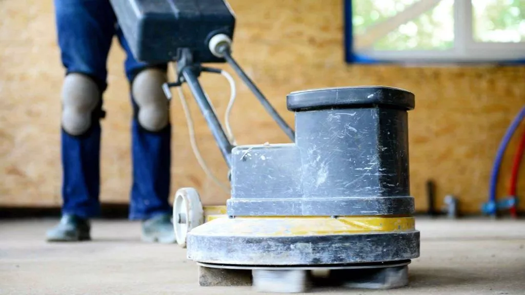 A photo of a grinder polishing concrete surface